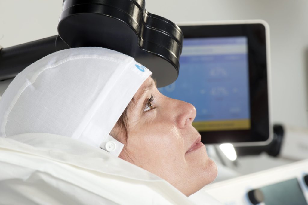 Woman receives TMS Therapy